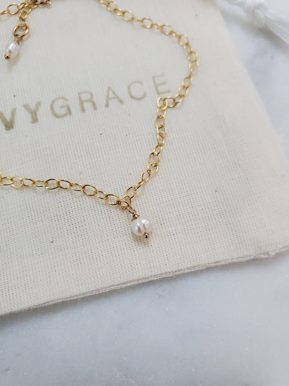 Dainty gold chain & freshwater pearl bracelet